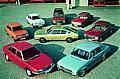 Die Modellpalette der Audi NSU Auto Union AG im Jahre 1971 (im Uhrzeigersinn): NSU Ro 80, NSU Prinz 1000 TT, NSU Prinz 4, Audi 75 Variant, NSU 1200, Audi 60 L, Audi 100 LS, Audi 100 Coupe´ S (Mitte).